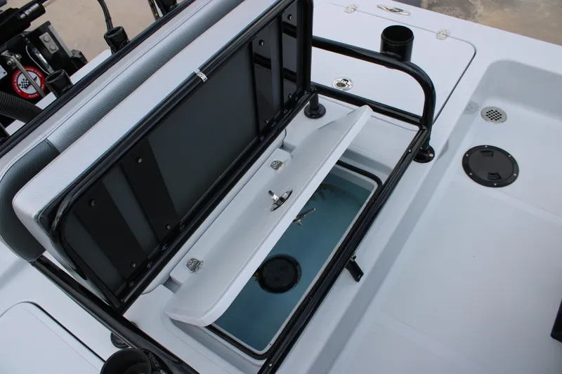 Slide: The Image of 2026 Mamba 24 Cat Elite boat interior with open storage compartment and seating. - 8
