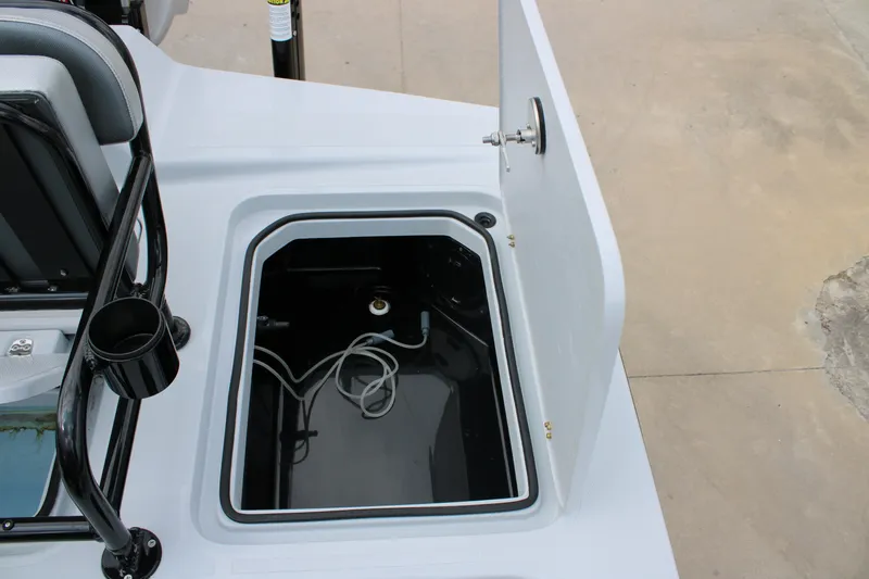Slide: The Image of Open storage compartment on 2026 Mamba 24 Cat Elite boat, featuring sleek design and utility. - 9