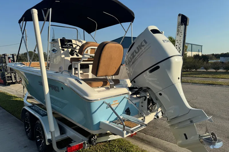 Slide: The Image of 2024 Sea Pro 202 Center Console boat with Suzuki outboard motor on trailer. - 16