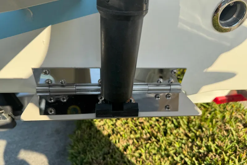 Slide: The Image of 2024 Sea Pro 202 Center Console boat detail showing a stainless steel hinge and black component. - 19
