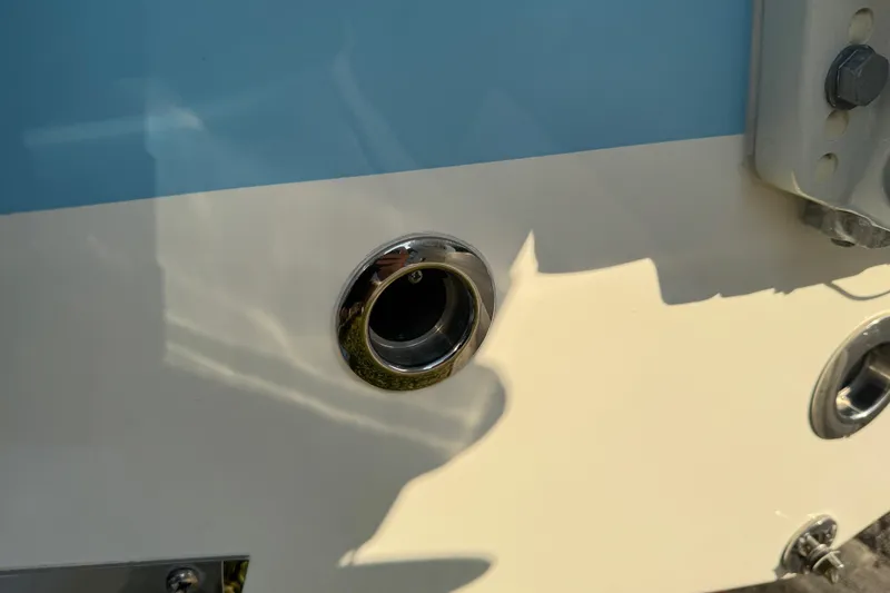 Slide: The Image of Stainless steel ladder on 2024 Sea Pro 202 Center Console boat, resting on grass. - 20