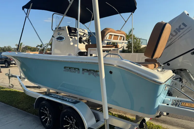 Slide: The Image of 2024 Sea Pro 202 Center Console boat detail, featuring a metal fitting on the hull. - 22