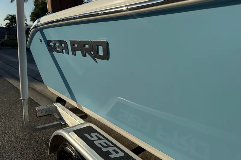 Slide: The Image of 2024 Sea Pro 202 Center Console boat on trailer, side view. - 29
