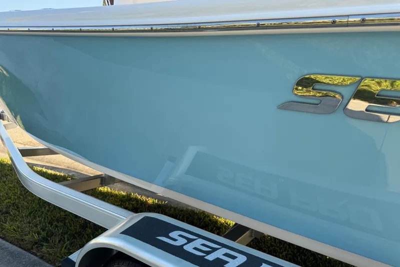 Slide: The Image of 2024 Sea Pro 202 Center Console boat on trailer, side view. - 31