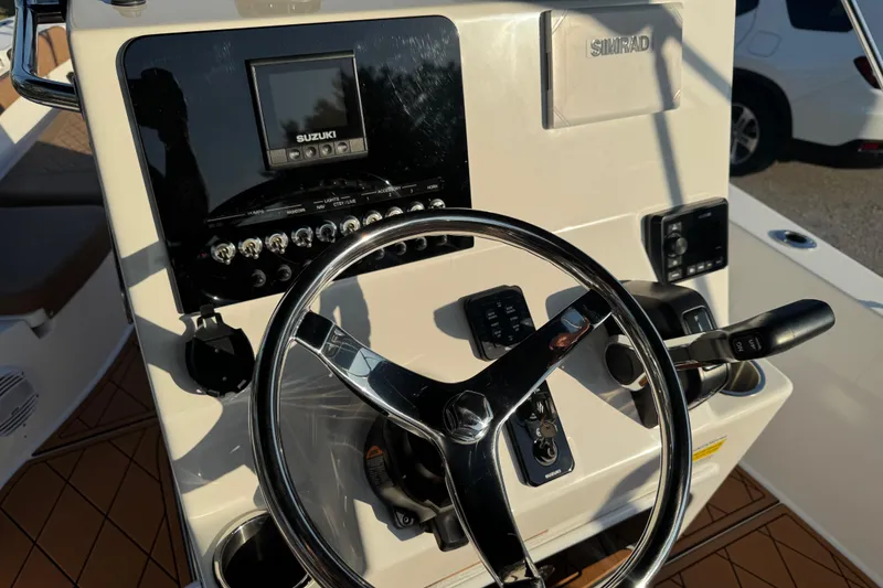 Slide: The Image of 2024 Sea Pro 202 Center Console boat on trailer, showcasing sleek blue hull design. - 35