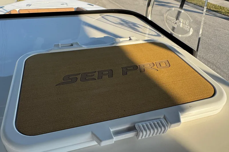 Slide: The Image of 2024 Sea Pro 202 Center Console boat dashboard with steering wheel and controls. - 37