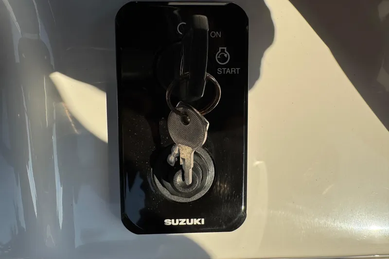 Slide: The Image of 2024 Sea Pro 202 Center Console audio control panel with volume and playback buttons. - 43