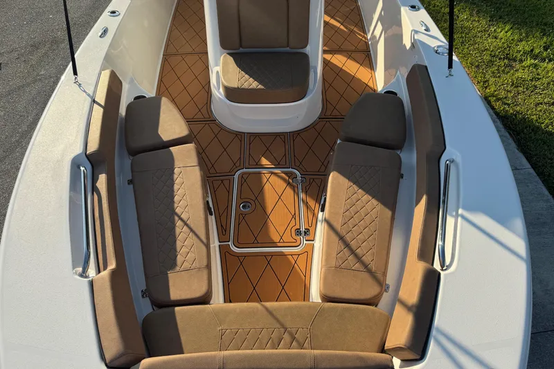 Slide: The Image of 2024 Sea Pro 202 Center Console boat interior with cushioned seating and non-slip flooring. - 49
