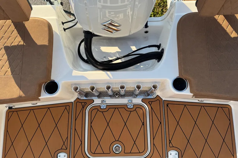 Slide: The Image of 2024 Sea Pro 202 Center Console boat interior with teak flooring and console details. - 57