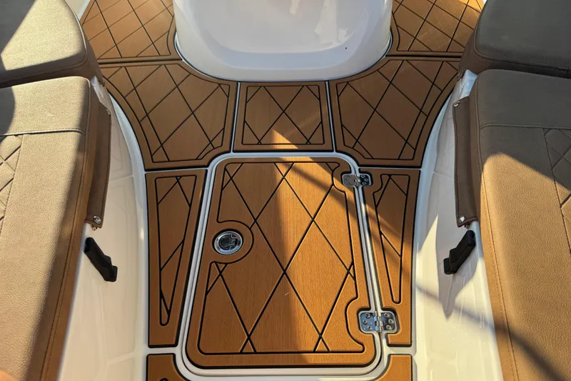 Slide: The Image of 2024 Sea Pro 202 Center Console boat speaker on teak-patterned deck. - 68