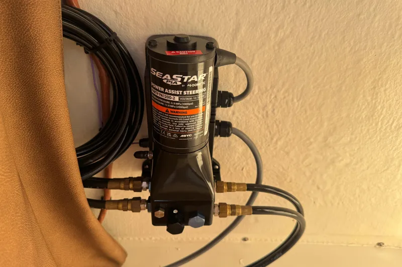 Slide: The Image of 2024 Sea Pro 202 Center Console boat seat with diamond-patterned upholstery and teak-style flooring. - 74