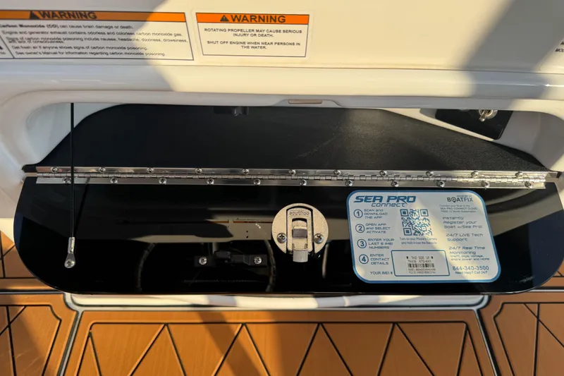 Slide: The Image of 2024 Sea Pro 202 Center Console dashboard with warning labels and Sea Pro Connect information. - 89
