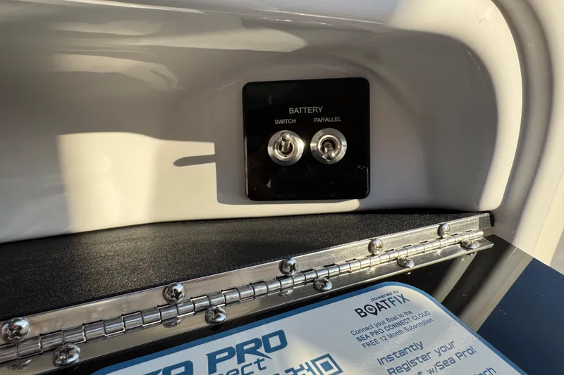 Slide: The Image of 2024 Sea Pro 202 Center Console battery switch panel with parallel option and registration details. - 90