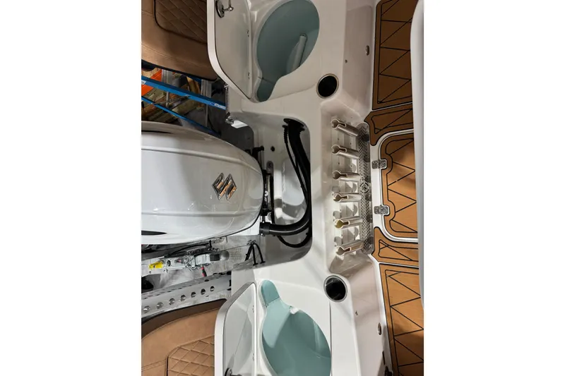 Slide: The Image of 2024 Sea Pro 202 Center Console boat interior with engine and storage compartments. - 96