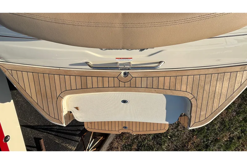 Slide: The Image of 2026 Chris-Craft Sportster 28 boat with luxurious tan seating and sleek design. - 10