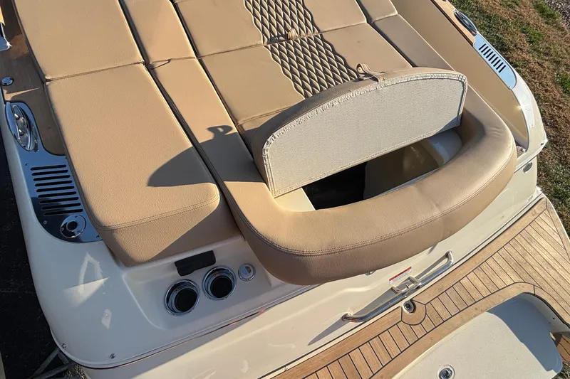 Slide: The Image of Interior view of 2026 Chris-Craft Sportster 28, featuring seating and storage compartments. - 12