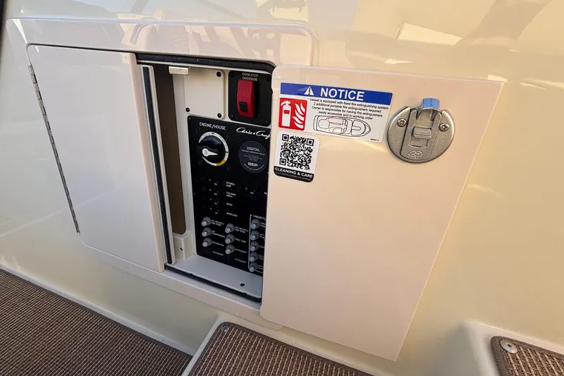 Slide: The Image of 2026 Chris-Craft Sportster 28 interior with control panel and seating area. - 14