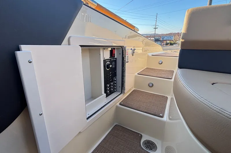 Slide: The Image of 2026 Chris-Craft Sportster 28 boat interior with beige leather seating and elegant design. - 15