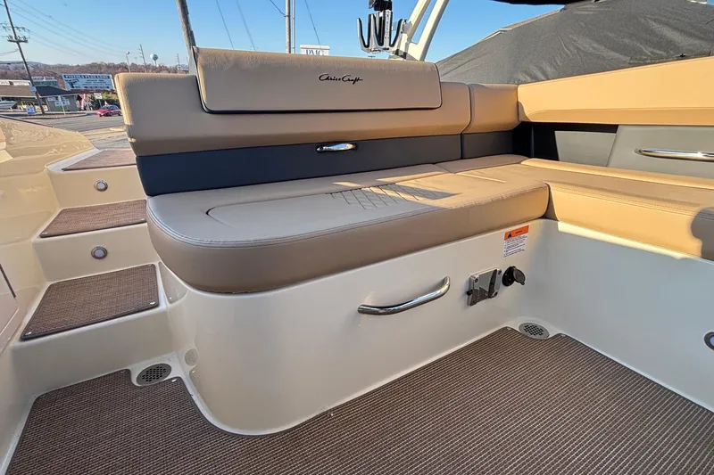 Slide: The Image of 2026 Chris-Craft Sportster 28 interior seating with beige upholstery and sleek design. - 17
