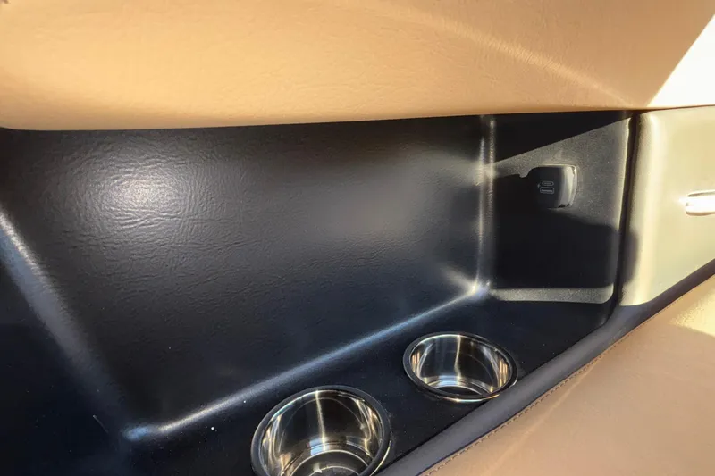 Slide: The Image of Luxurious interior of 2026 Chris-Craft Sportster 28 boat with tan leather seating. - 26