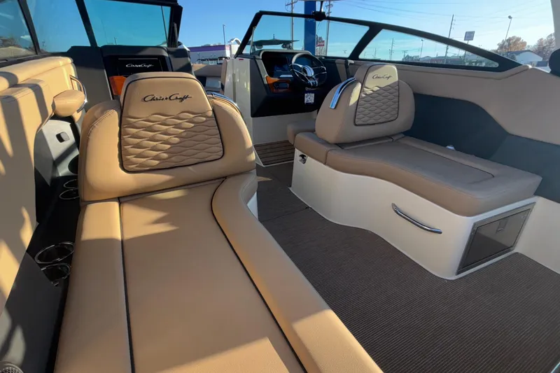 Slide: The Image of 2026 Chris-Craft Sportster 28 interior with beige seating and modern design. - 27