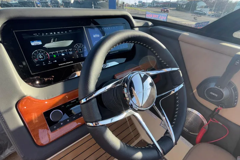 Slide: The Image of Dashboard of 2026 Chris-Craft Sportster 28 boat with digital display and controls. - 29