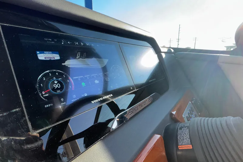 Slide: The Image of 2026 Chris-Craft Sportster 28 dashboard with modern steering wheel and digital display. - 30