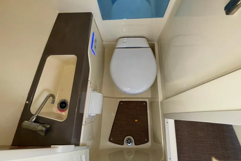 Slide: The Image of 2026 Chris-Craft Sportster 28 boat interior with modern dashboard and steering wheel. - 44