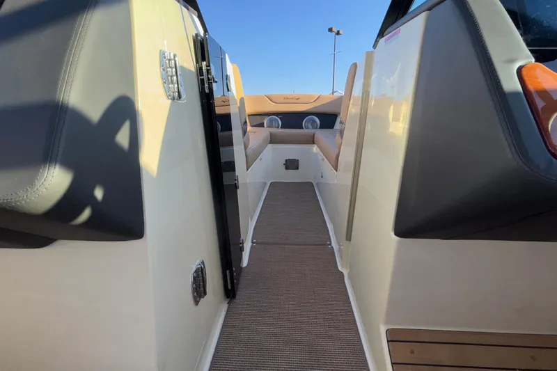 Slide: The Image of 2026 Chris-Craft Sportster 28 interior with tan seating and modern design. - 46
