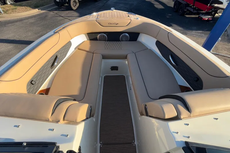 Slide: The Image of 2026 Chris-Craft Sportster 28 boat interior with beige seating and elegant design. - 48