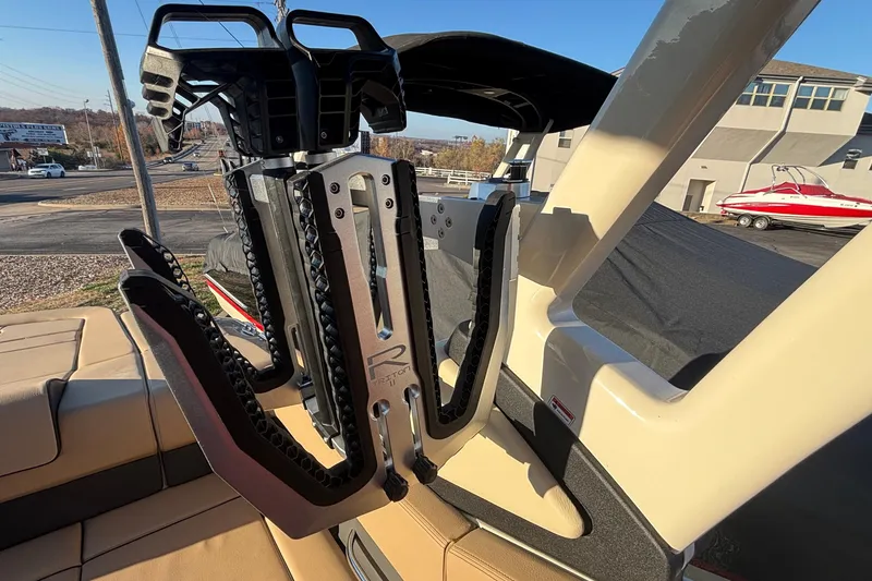 Slide: The Image of 2026 Chris-Craft Sportster 28 boat on display under clear blue sky. - 5