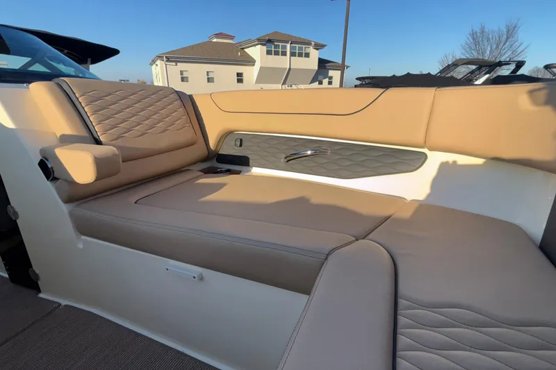 Slide: The Image of 2026 Chris-Craft Sportster 28 boat interior with modern dashboard and steering wheel. - 57