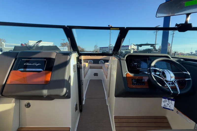 Slide: The Image of 2026 Chris-Craft Sportster 28 boat on display, featuring sleek design and modern amenities. - 58