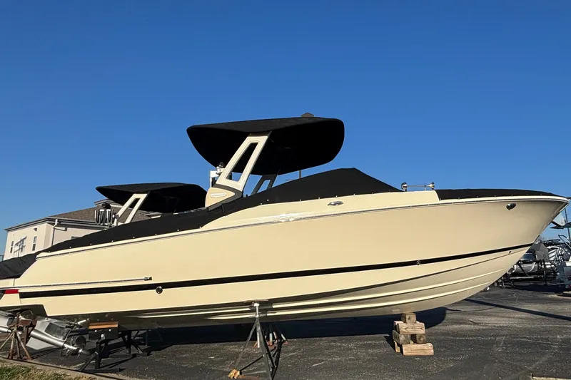 Slide: The Image of 2026 Chris-Craft Sportster 28 boat rear view, showcasing propeller and trim tabs. - 7