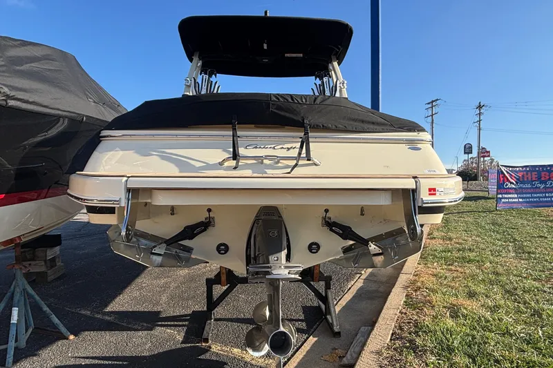 Slide: The Image of 2026 Chris-Craft Sportster 28 boat with elegant teak deck and sleek design. - 9