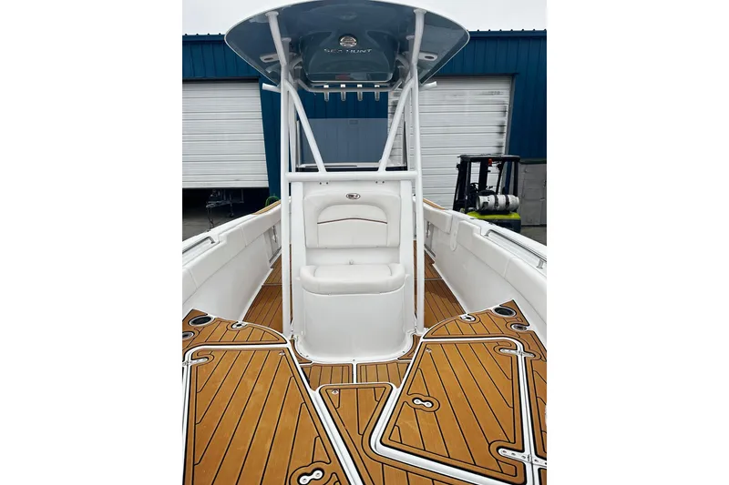 Slide: The Image of 2022 Sea Hunt Ultra 234 boat with sleek deck design and comfortable seating. - 6