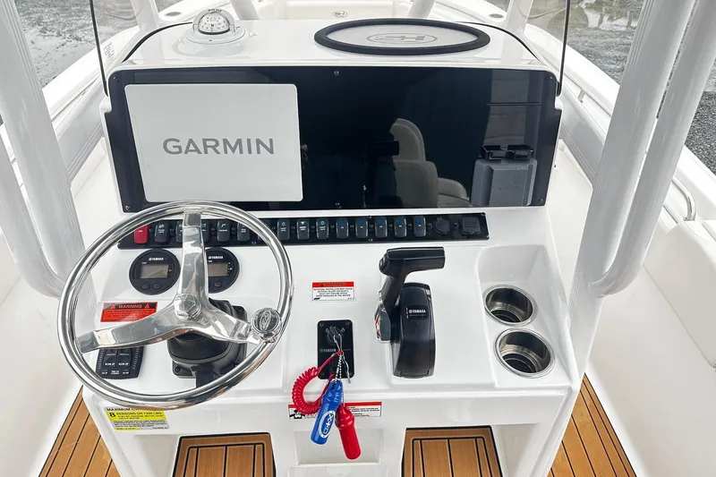 Slide: The Image of 2022 Sea Hunt Ultra 234 boat console with Garmin navigation and Yamaha controls. - 8