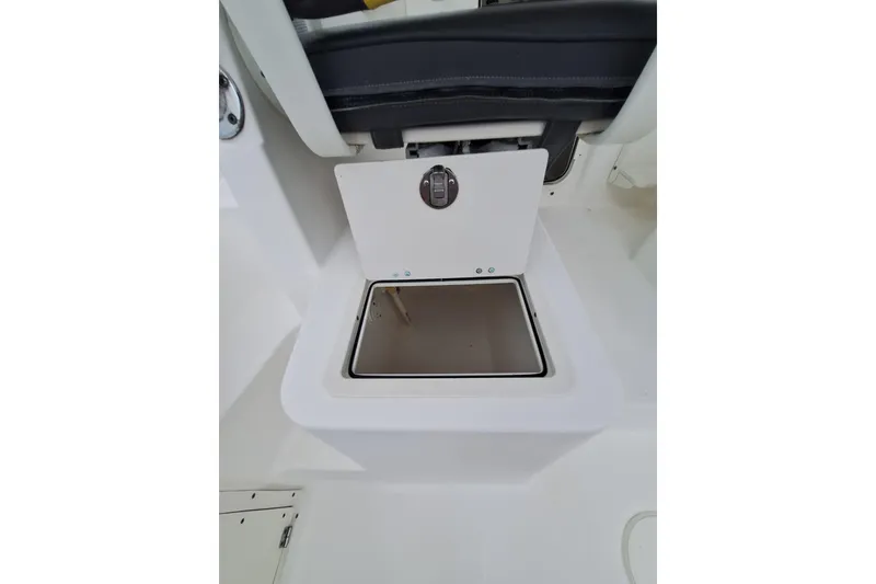 Slide: The Image of Open storage compartment on a 2006 Century 2400 Walkaround boat. - 23