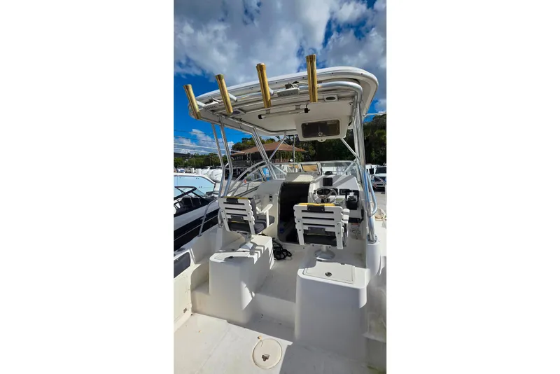 Slide: The Image of 2006 Century 2400 Walkaround boat interior with seating and storage compartments. - 7