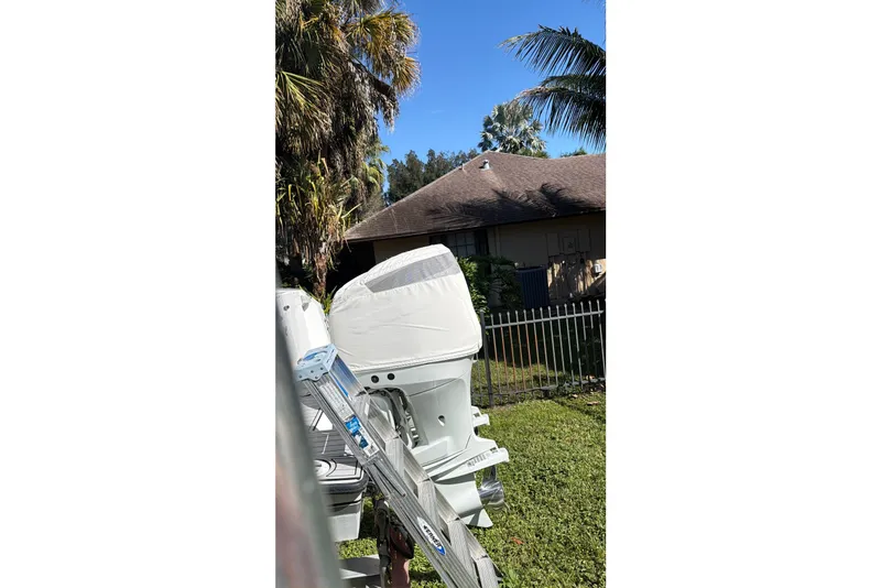 Slide: The Image of 2002 Contender 35 Side Console boat on trailer, viewed from above. - 17