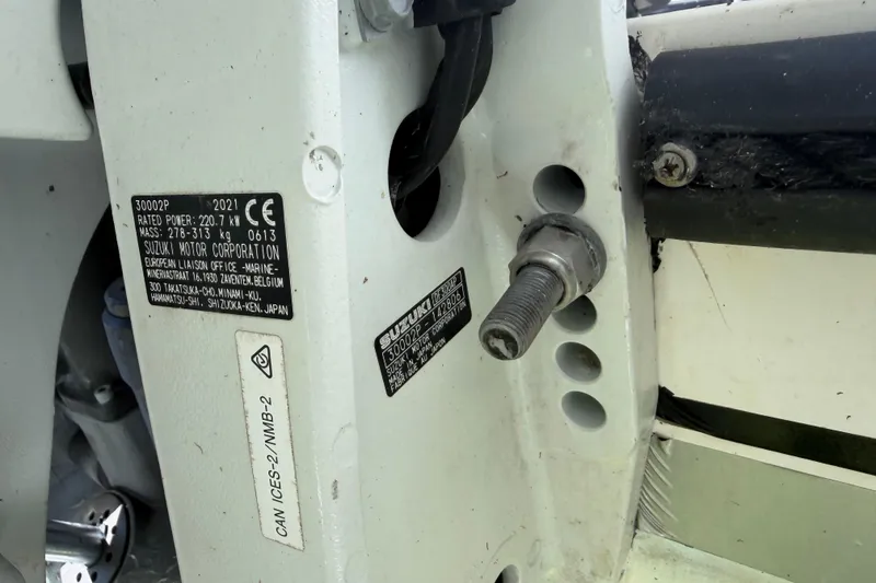 Slide: The Image of 2002 Contender 35 Side Console engine compartment with fuel filters and hoses. - 22