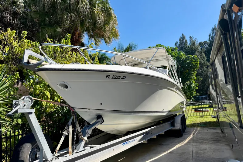 Slide: The Image of 2002 Contender 35 Side Console boat with sleek design and modern equipment. - 4