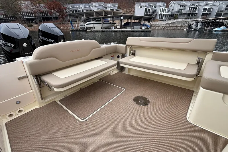 Slide: The Image of 2026 Chris-Craft Calypso 28 boat interior with seating and Mercury engines. - 13