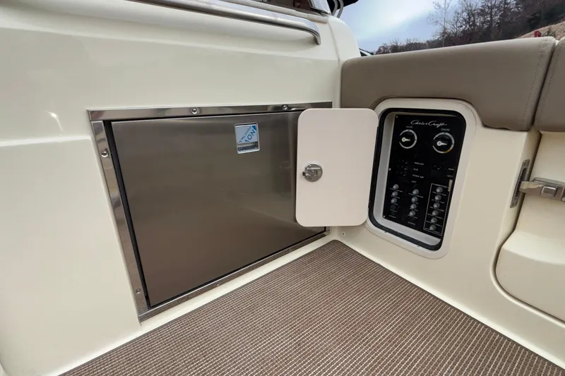 Slide: The Image of 2026 Chris-Craft Calypso 28 interior panel and storage compartment detail. - 18