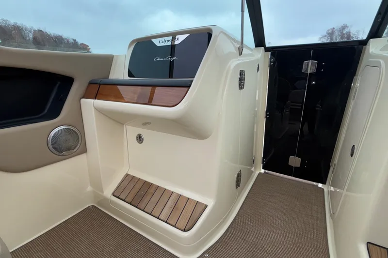 Slide: The Image of 2026 Chris-Craft Calypso 28 interior with elegant wood accents and modern design. - 25