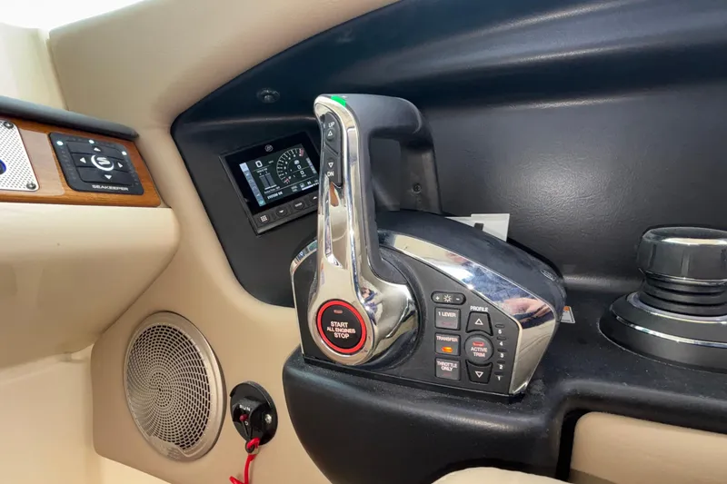 Slide: The Image of Control panel of 2026 Chris-Craft Calypso 28 boat with throttle and display. - 31