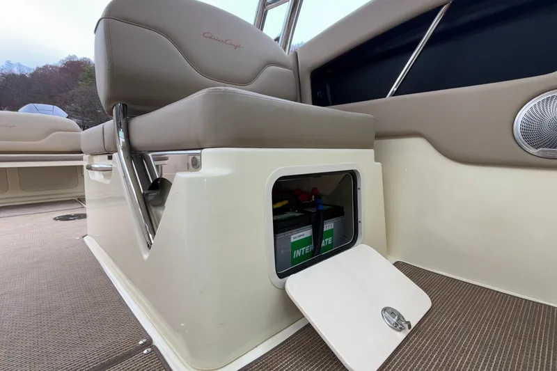 Slide: The Image of 2026 Chris-Craft Calypso 28 interior with storage compartment and seating detail. - 32