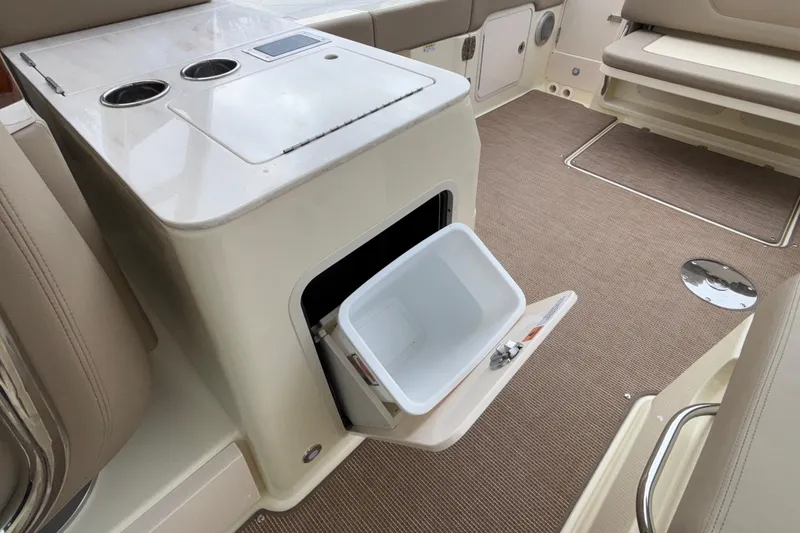 Slide: The Image of 2026 Chris-Craft Calypso 28 interior with storage compartment and seating. - 35