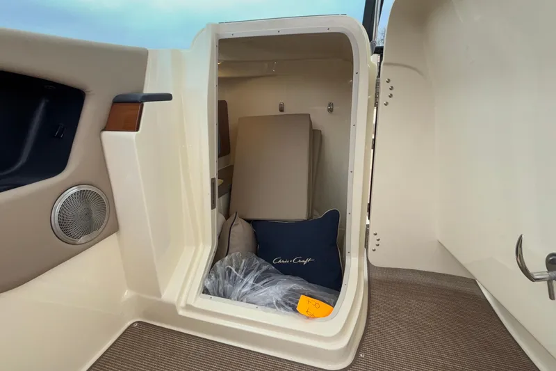Slide: The Image of 2026 Chris-Craft Calypso 28 cabin interior with cushions and speaker. - 38