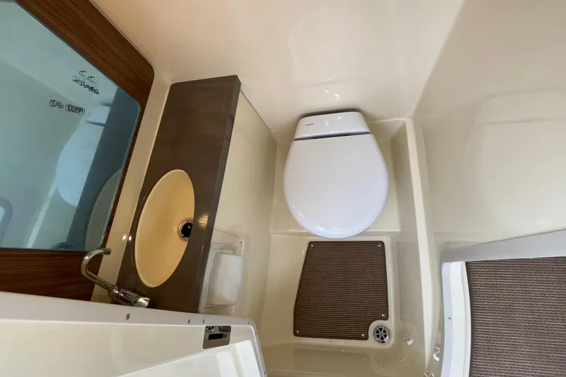 Slide: The Image of 2026 Chris-Craft Calypso 28 boat bathroom with sink and toilet. - 40